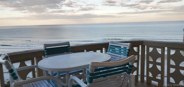 a terrace of a house with outdoor seating