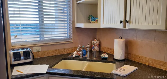 a room with pool table and a window