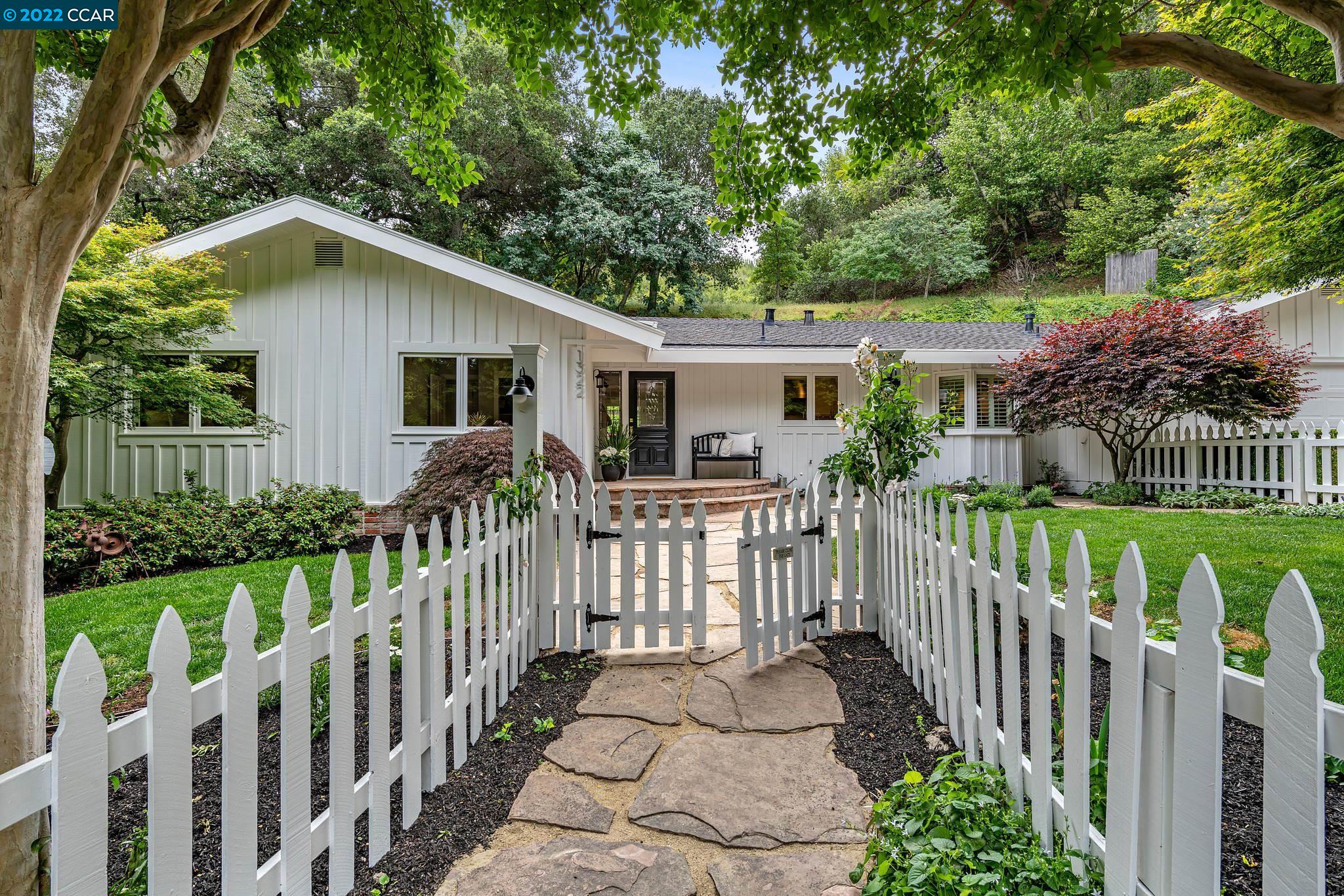 1322 Martino Road Lafayette, CA 94549 - Photo 1 of 1 a view of a house with wooden fence and trees