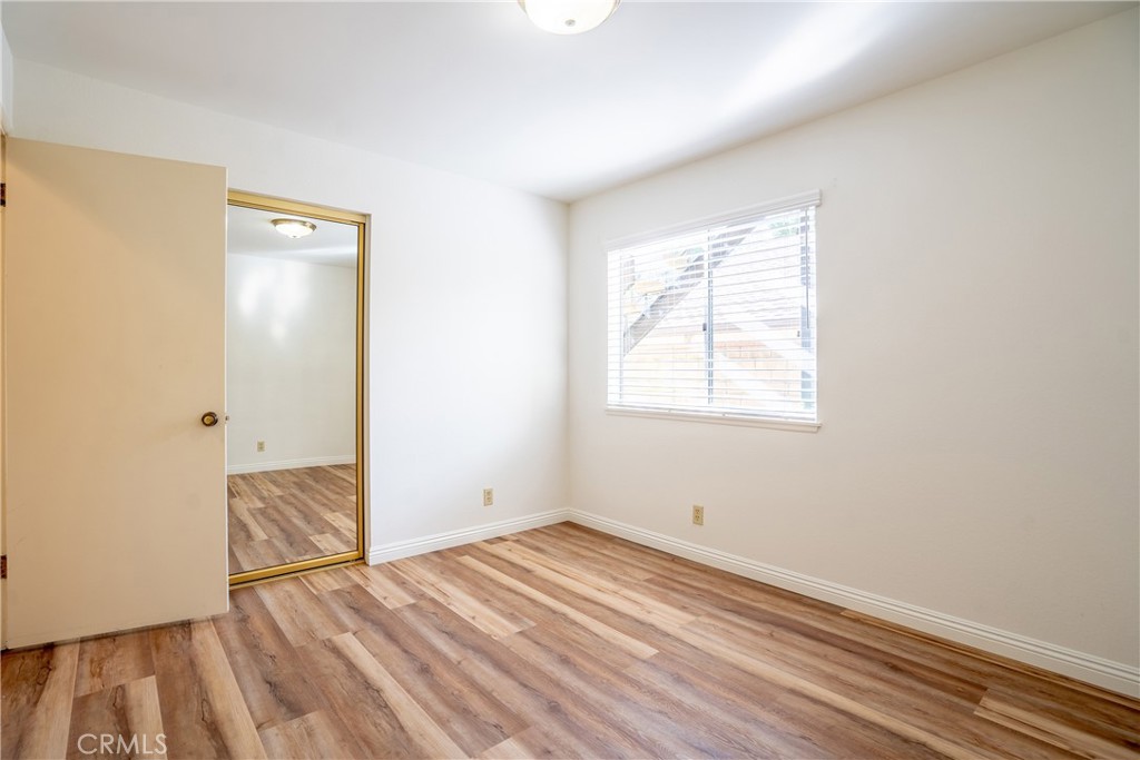 3610 Cartwright Street Pasadena, CA 91107 - Photo 26 of 75 an empty room with wooden floor and windows
