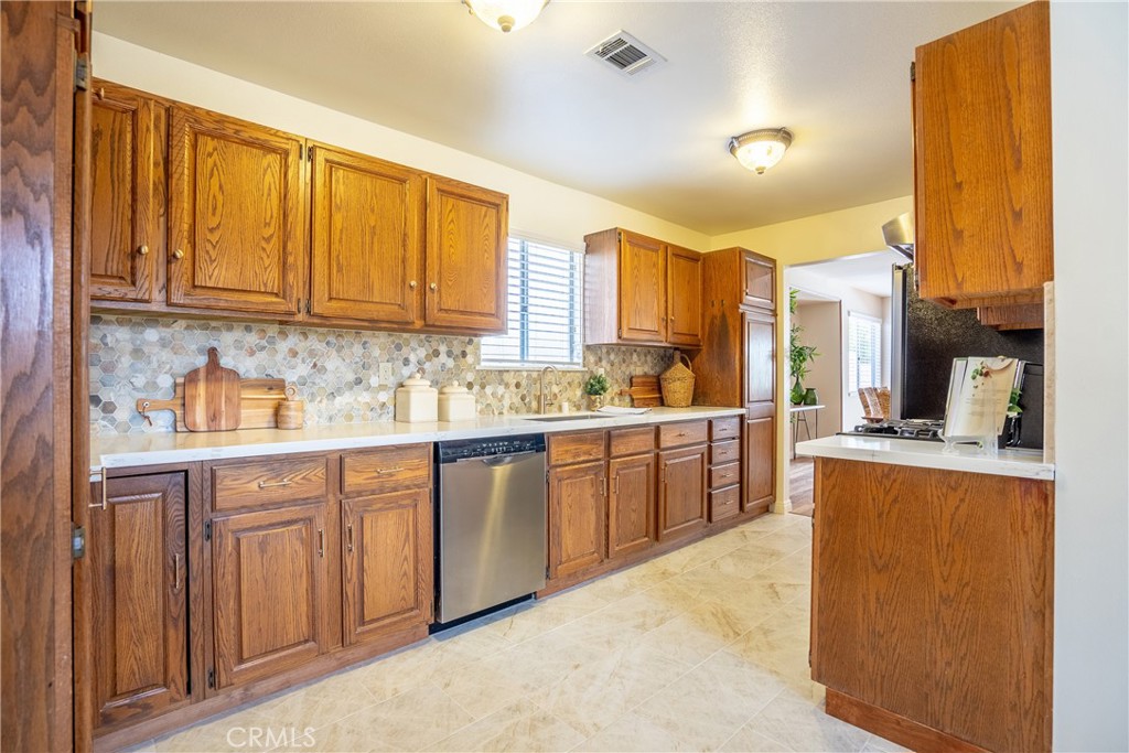 3610 Cartwright Street Pasadena, CA 91107 - Photo 41 of 75 a kitchen with stainless steel appliances granite countertop a stove a sink and a refrigerator