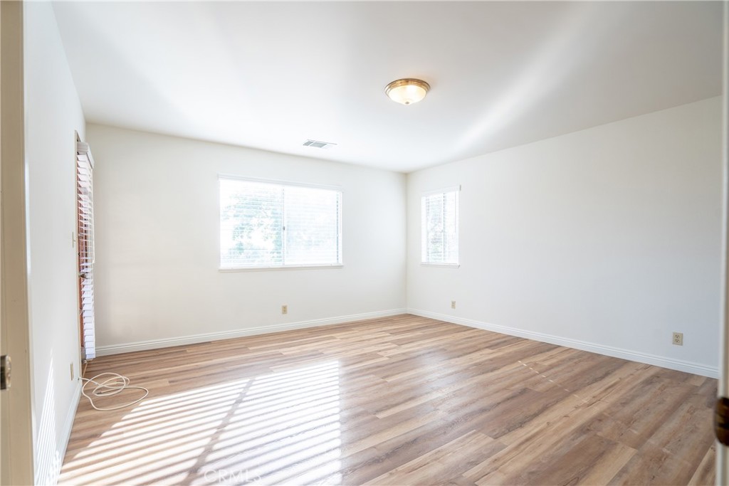 3610 Cartwright Street Pasadena, CA 91107 - Photo 54 of 75 an empty room with wooden floor and windows