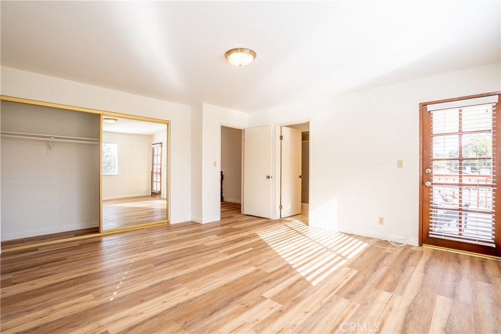 3610 Cartwright Street Pasadena, CA 91107 - Photo 56 of 75 a view of an empty room with wooden floor and a window