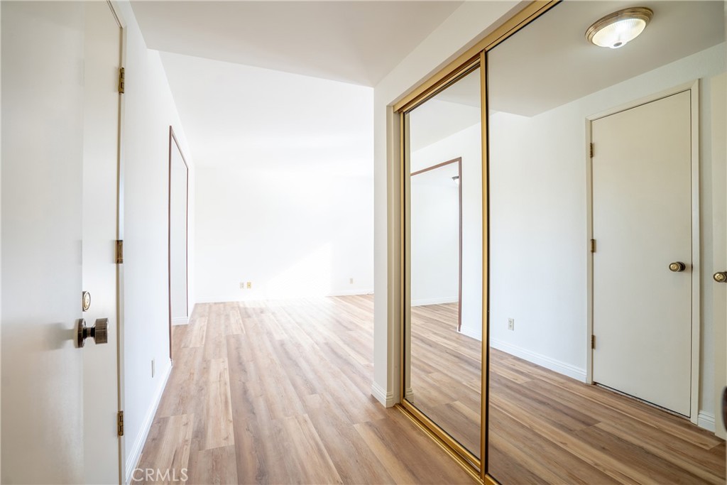 3610 Cartwright Street Pasadena, CA 91107 - Photo 59 of 75 a view of a hallway with wooden floor and staircase
