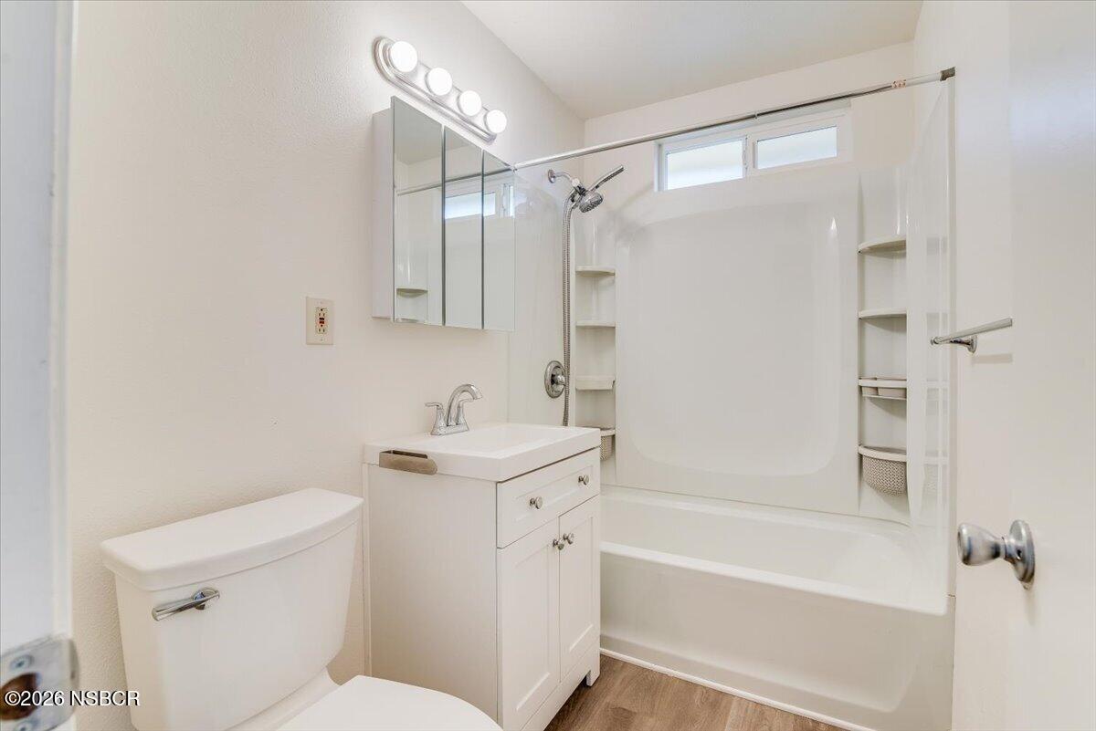 321 North Z Street Lompoc, CA 93436 - Photo 20 of 33 a bathroom with a sink mirror vanity and toilet