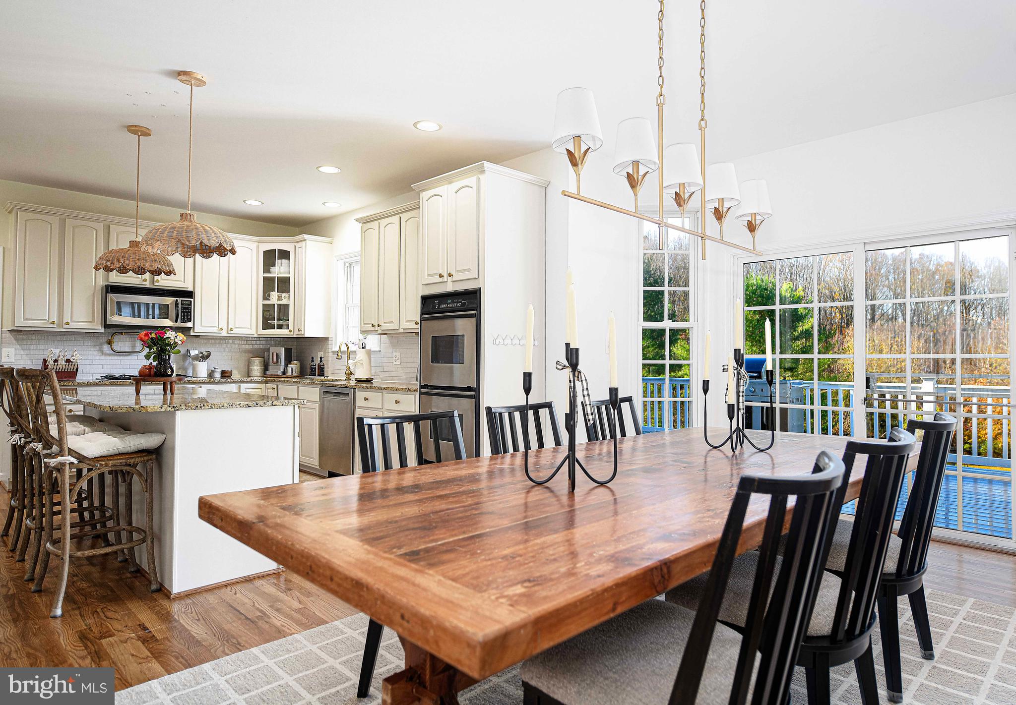 14516 Cuba Road Cockeysville, MD 21030 - Photo 27 of 79 a dining room with furniture a chandelier and wooden floor