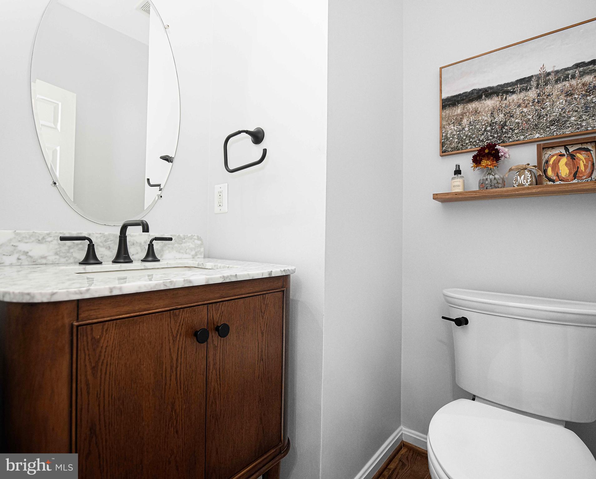 14516 Cuba Road Cockeysville, MD 21030 - Photo 37 of 79 a bathroom with a granite countertop toilet sink and mirror