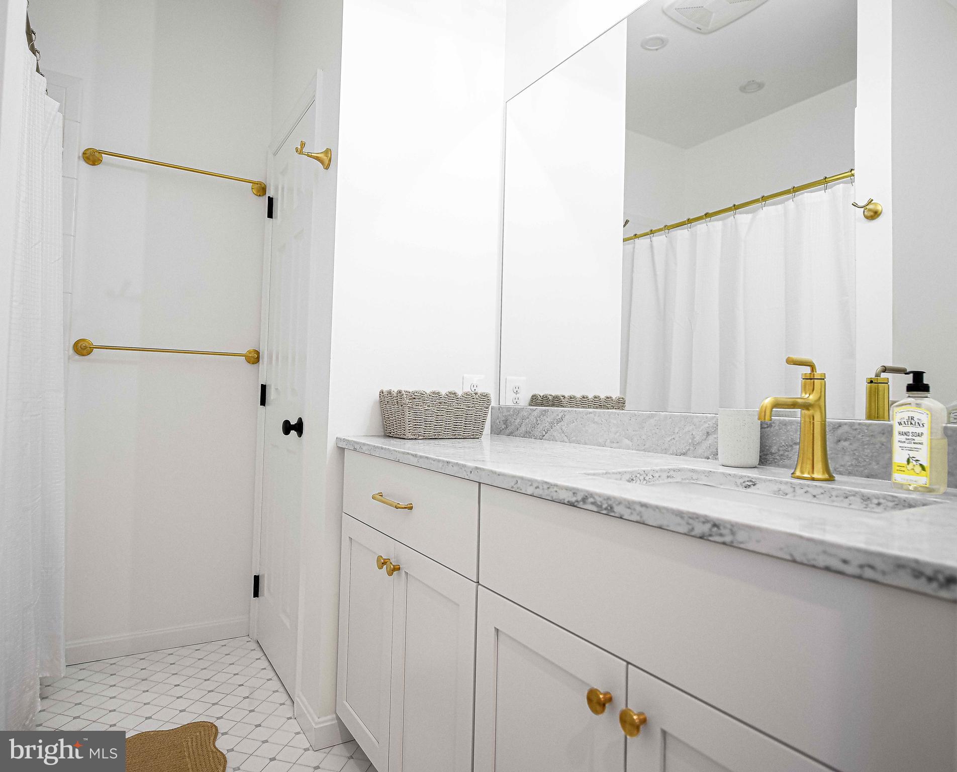 14516 Cuba Road Cockeysville, MD 21030 - Photo 50 of 79 a bathroom with a granite countertop sink and a mirror