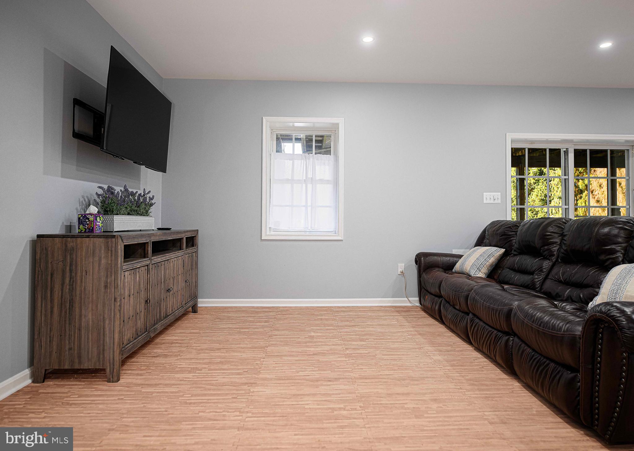 14516 Cuba Road Cockeysville, MD 21030 - Photo 58 of 79 a living room with furniture and a flat screen tv
