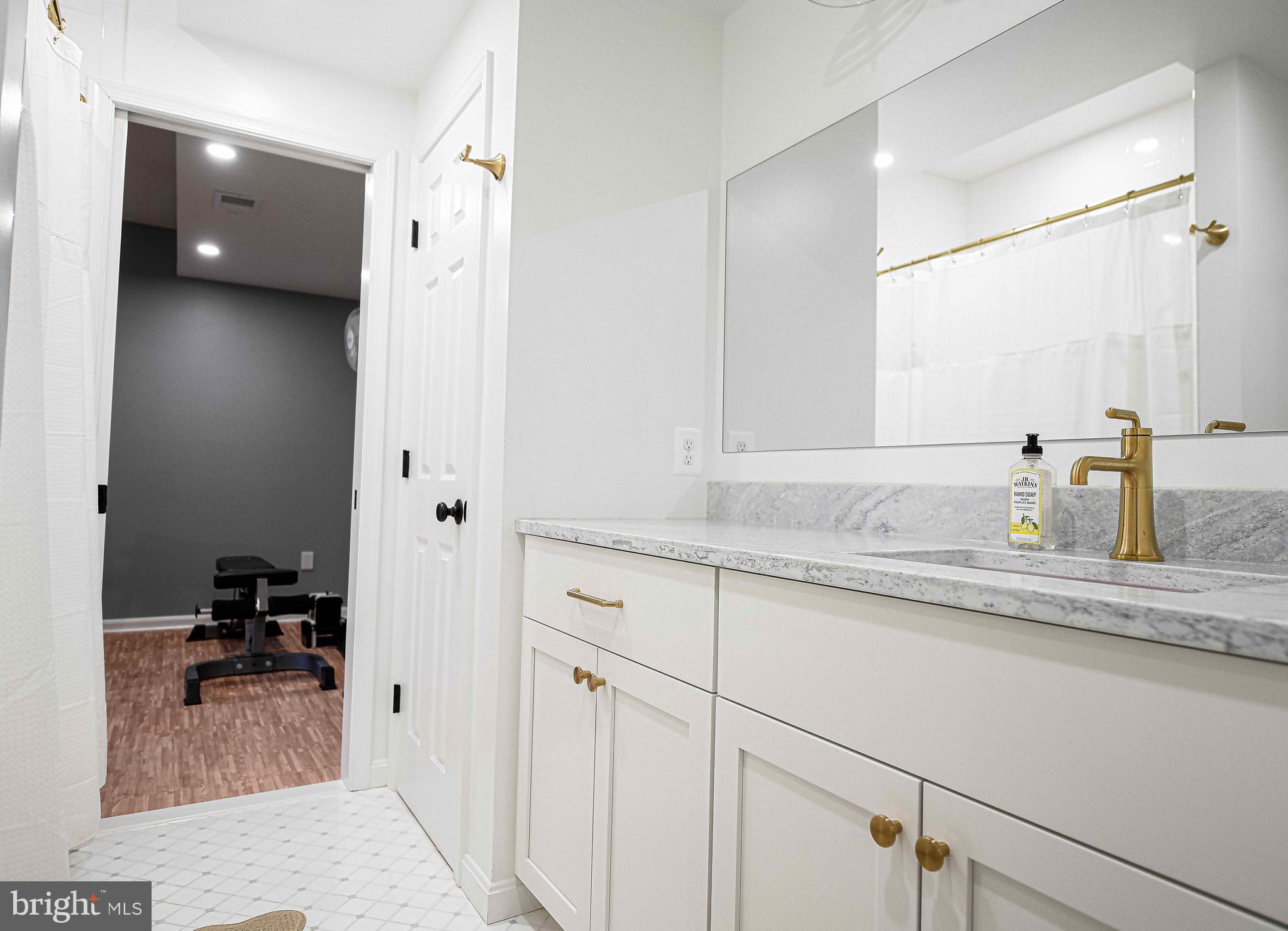 14516 Cuba Road Cockeysville, MD 21030 - Photo 59 of 79 a bathroom with a sink and a mirror