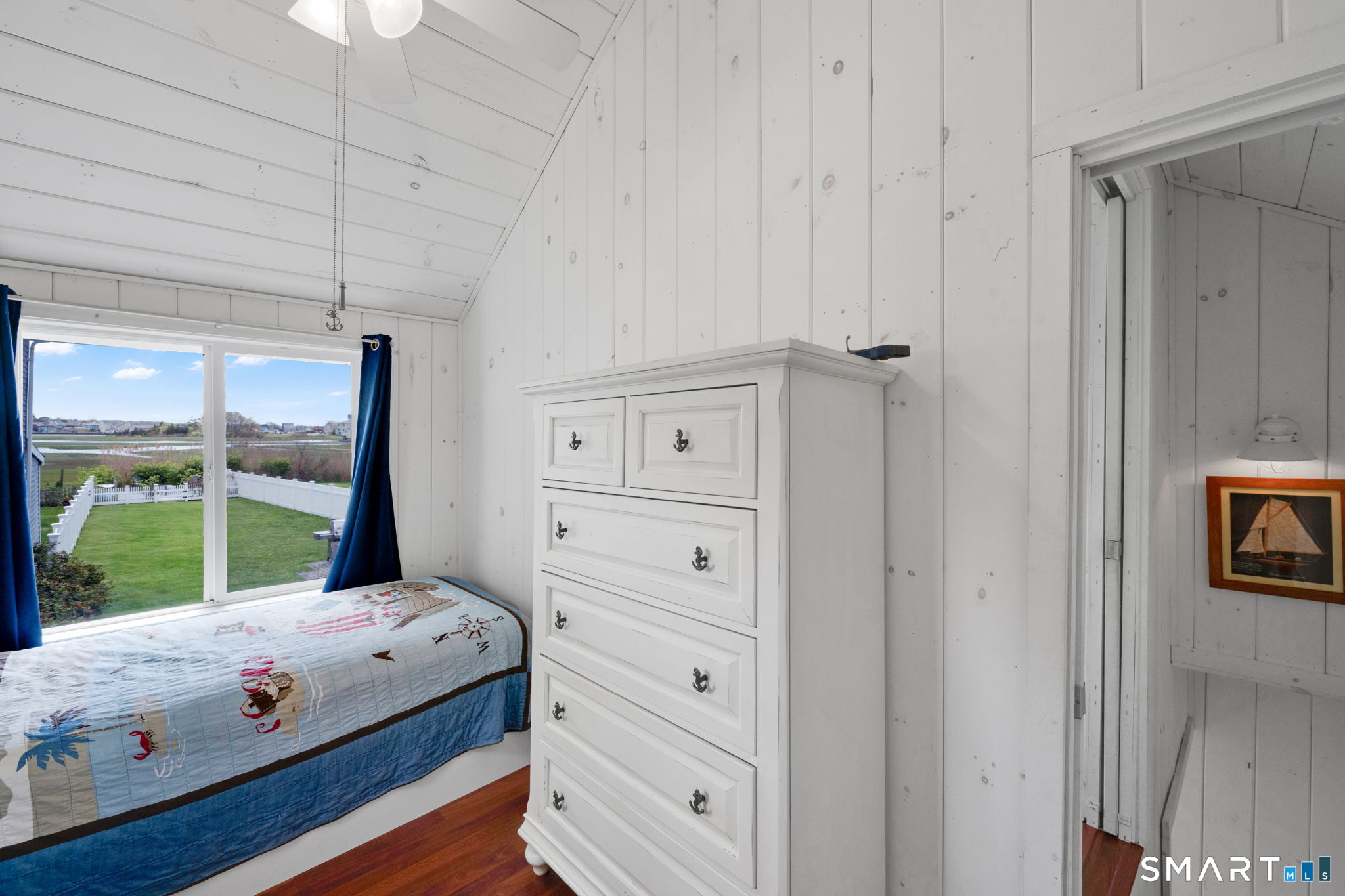 96 Chalker Beach Road Old Saybrook, CT 06475 - Photo 31 of 33 a bedroom with a bed and a window