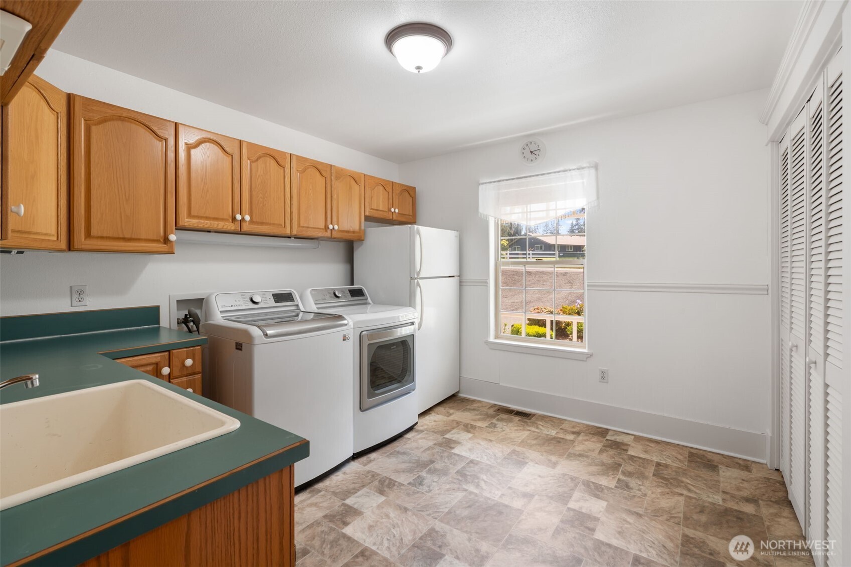 308 Brockway Road Chehalis, WA 98532 - Photo 29 of 40 a view of kitchen with window and refrigerator