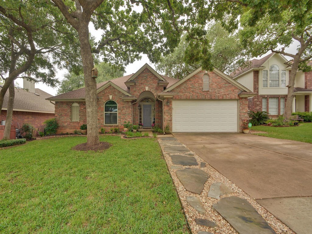 7929 Wheel Rim Circle Austin, TX 78749 - Photo 1 of 1 a front view of a house with a yard and garage