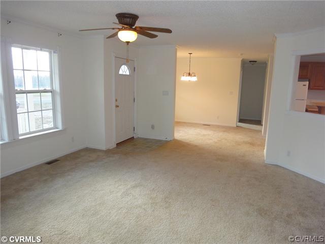 767 High School Ridge Buckingham, VA 23921 - Photo 9 of 12 an empty room with closet and a chandelier fan