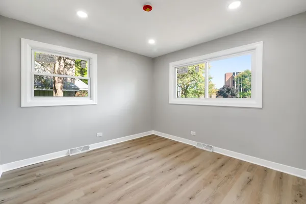a view of room with window and hardwood floor