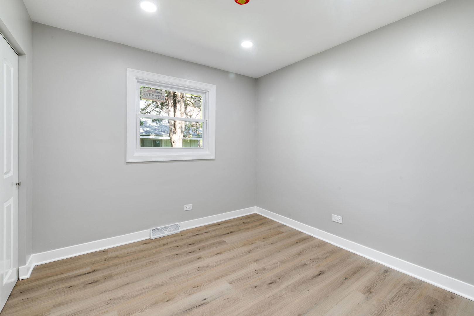 92 North Airlite Street Elgin, IL 60123 - Photo 14 of 25 wooden floor in an empty room with a window