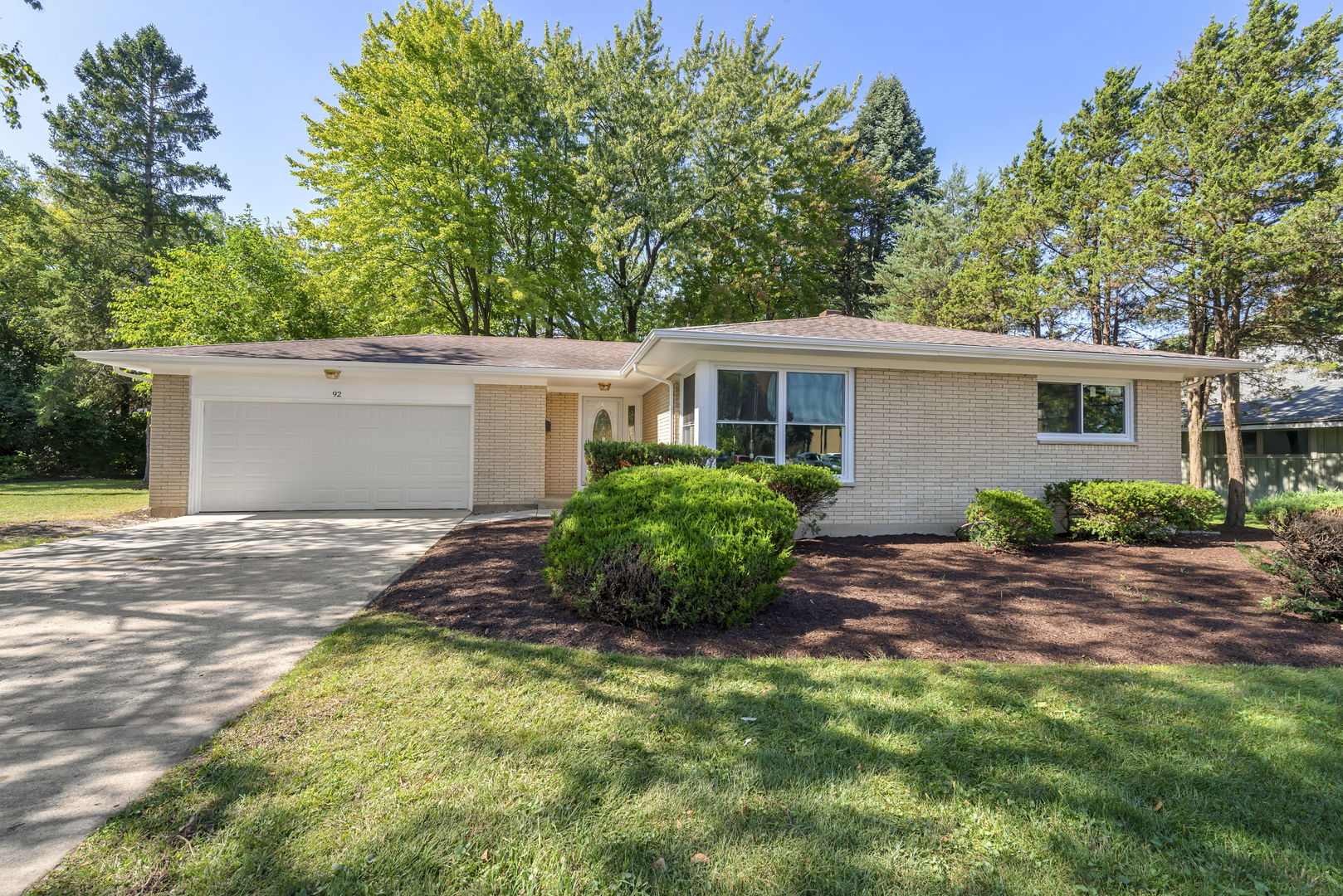 92 North Airlite Street Elgin, IL 60123 - Photo 2 of 25 a view of a house with backyard and plants