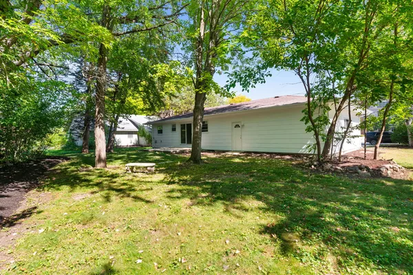 a view of a house with a backyard