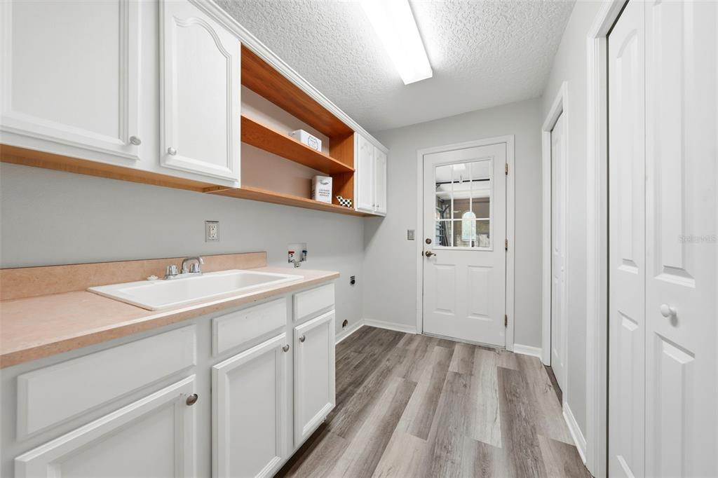 14433 Lake Yale Road Umatilla, FL 32784 - Photo 22 of 38 a view of a kitchen with cabinets