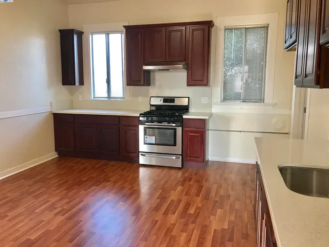 a kitchen with wooden cabinets