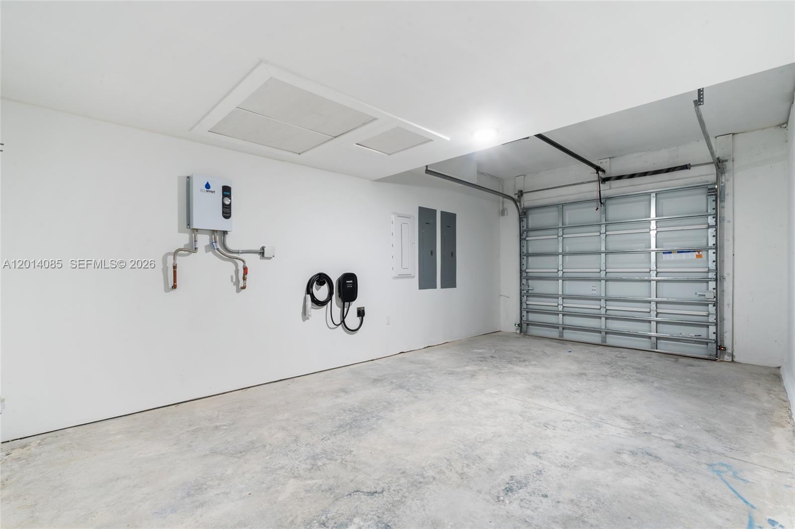 14530 Southwest 261st Terrace, Unit 1 Homestead, FL 33032 - Photo 14 of 17 a view of a garage