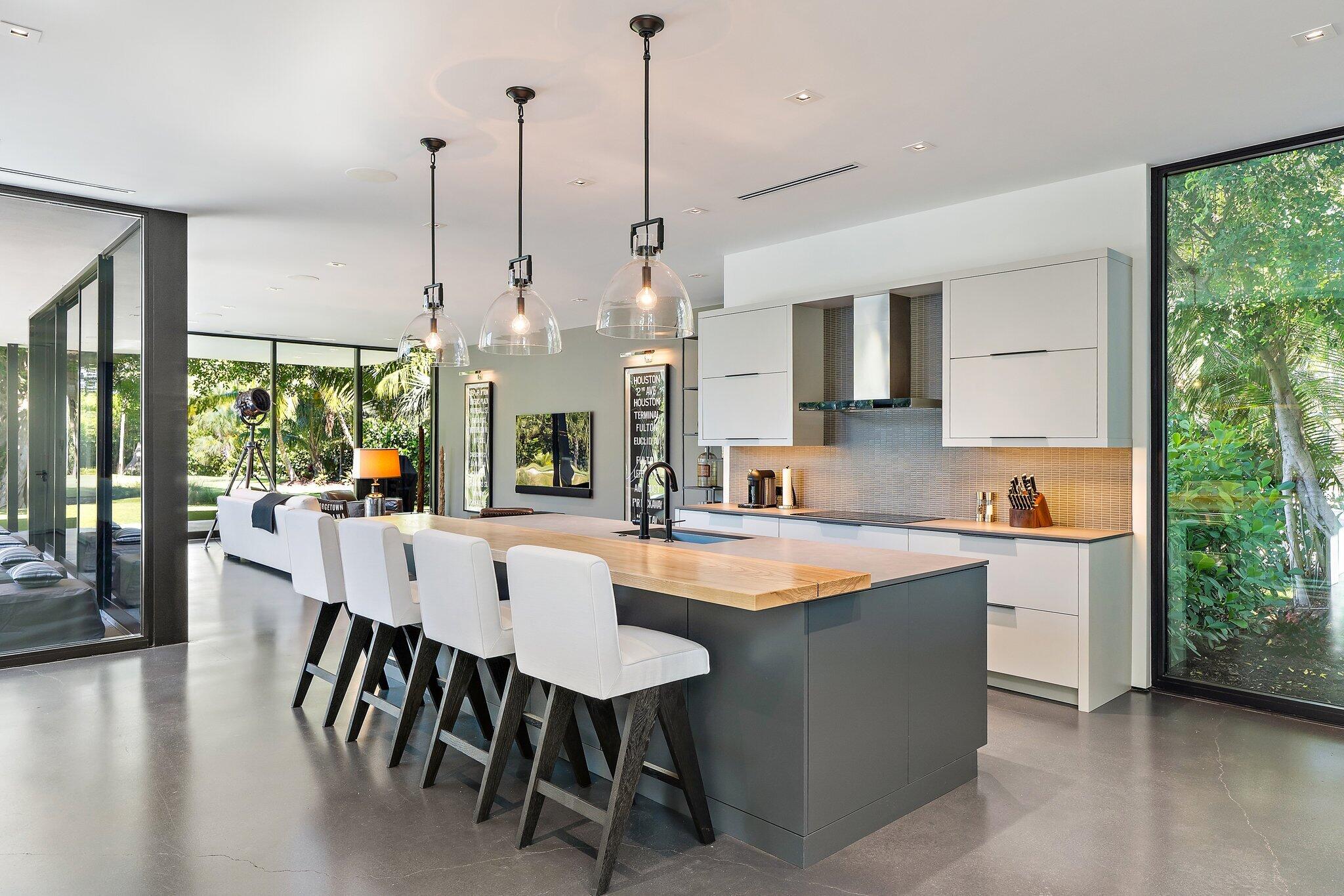 12 North Beach Road Jupiter Island, FL 33455 - Photo 15 of 95 a large kitchen with kitchen island a large island in it