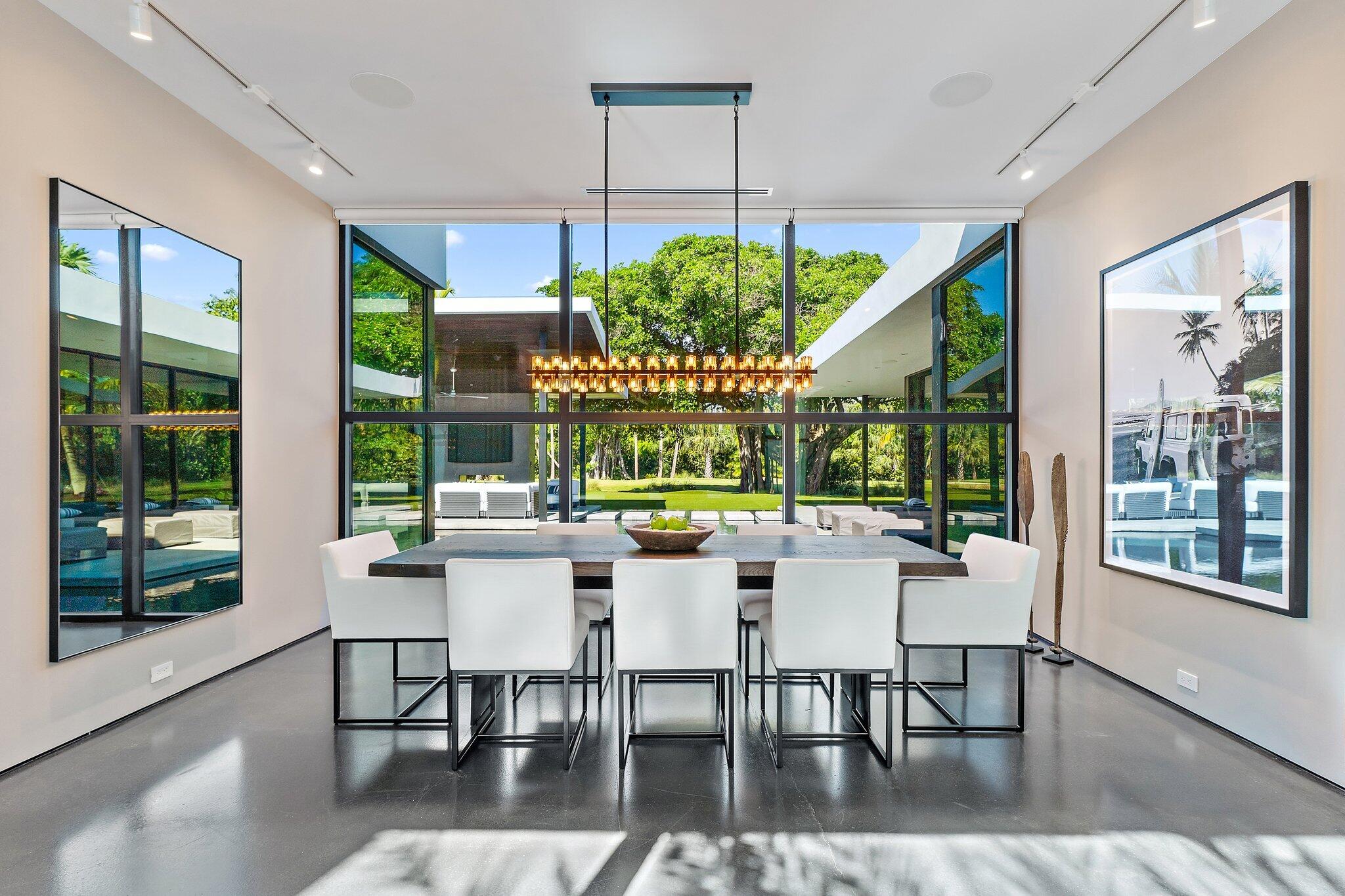 12 North Beach Road Jupiter Island, FL 33455 - Photo 23 of 95 a view of a dining room with furniture window and wooden floor
