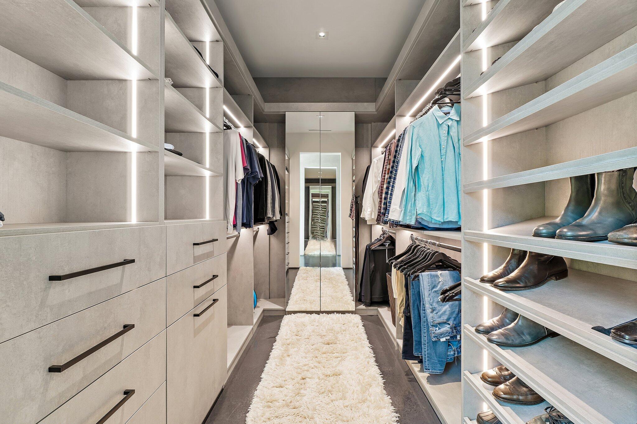 12 North Beach Road Jupiter Island, FL 33455 - Photo 31 of 95 a view of walk in closet with clothes and shoes