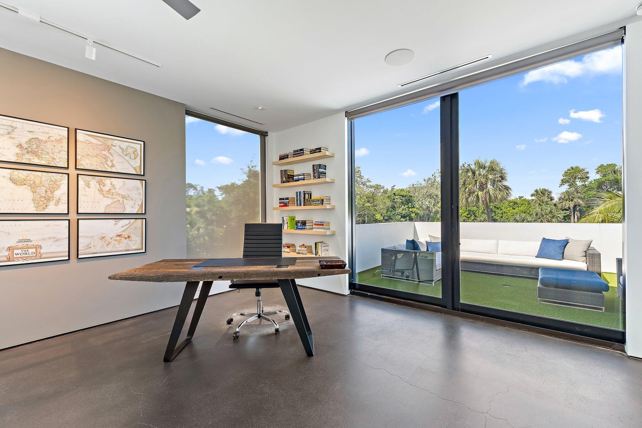 12 North Beach Road Jupiter Island, FL 33455 - Photo 36 of 95 a view of a room with workspace and windows