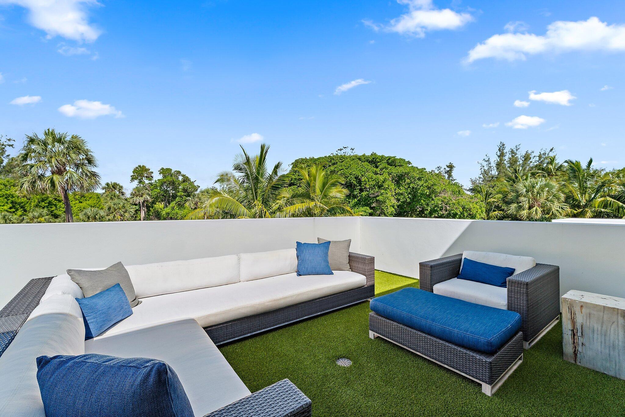 12 North Beach Road Jupiter Island, FL 33455 - Photo 39 of 95 a view of an outdoor sitting area with furniture