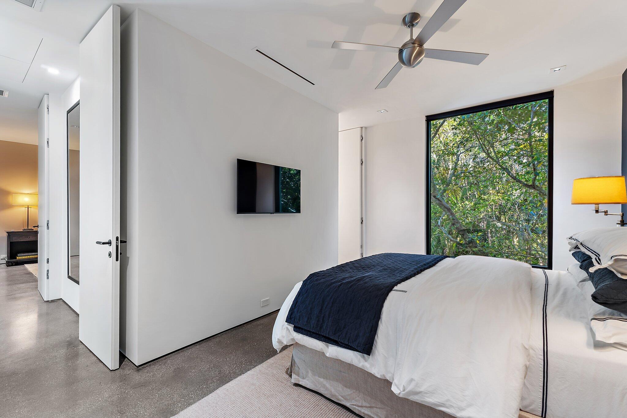 12 North Beach Road Jupiter Island, FL 33455 - Photo 47 of 95 a bedroom with a bed and a tv