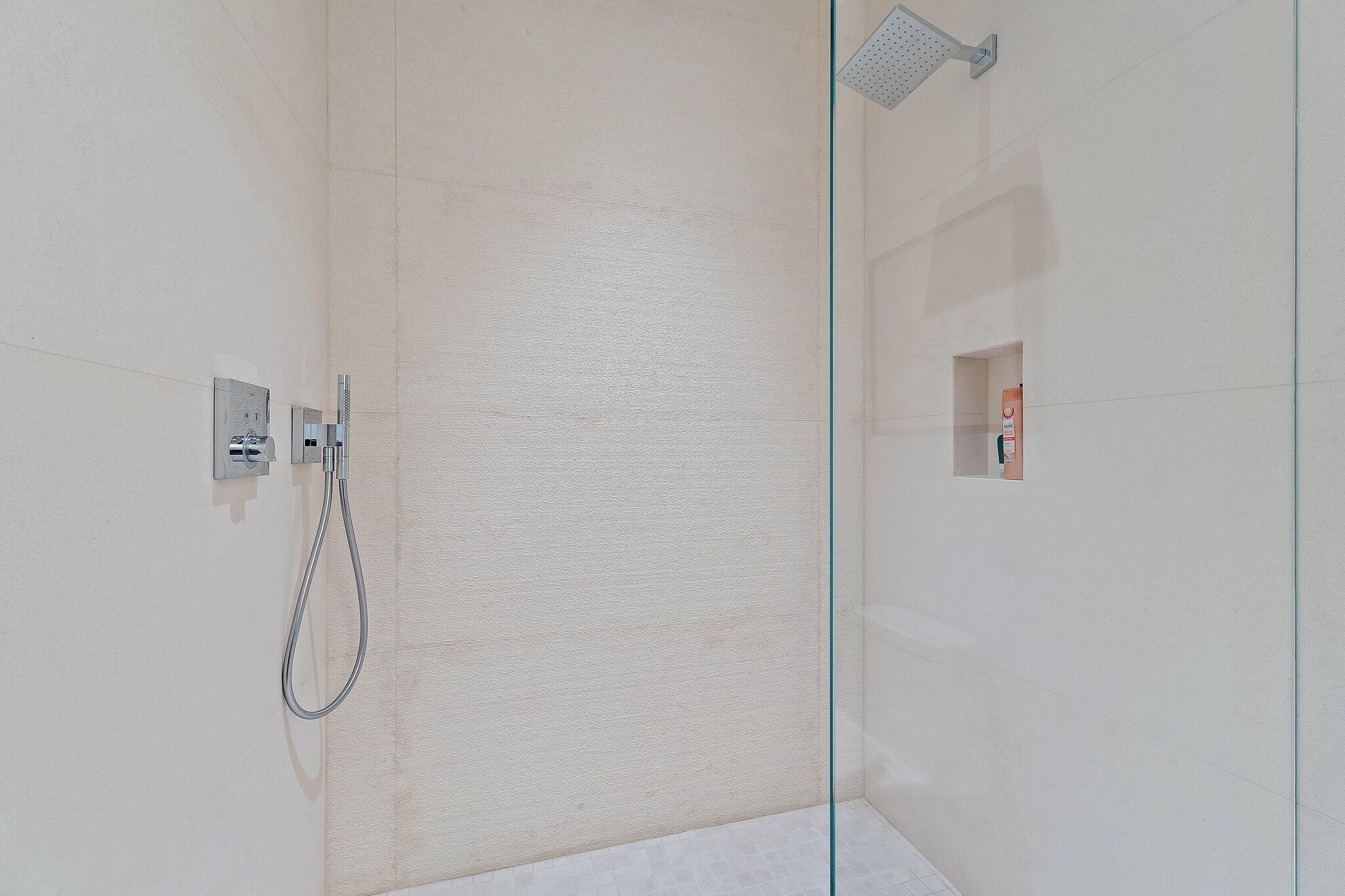 12 North Beach Road Jupiter Island, FL 33455 - Photo 49 of 95 a bathroom with a shower