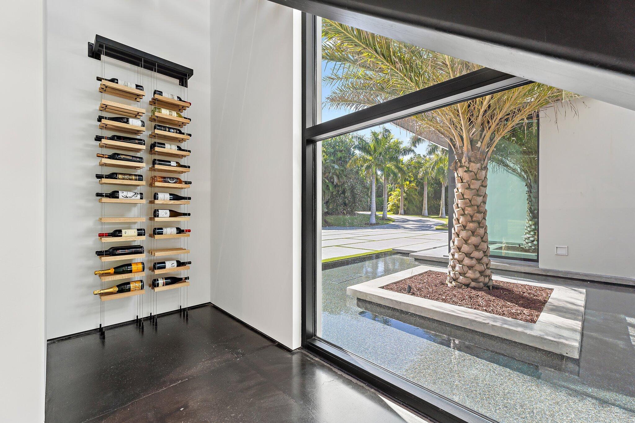 12 North Beach Road Jupiter Island, FL 33455 - Photo 55 of 95 a view of a living room with furniture and floor to ceiling window