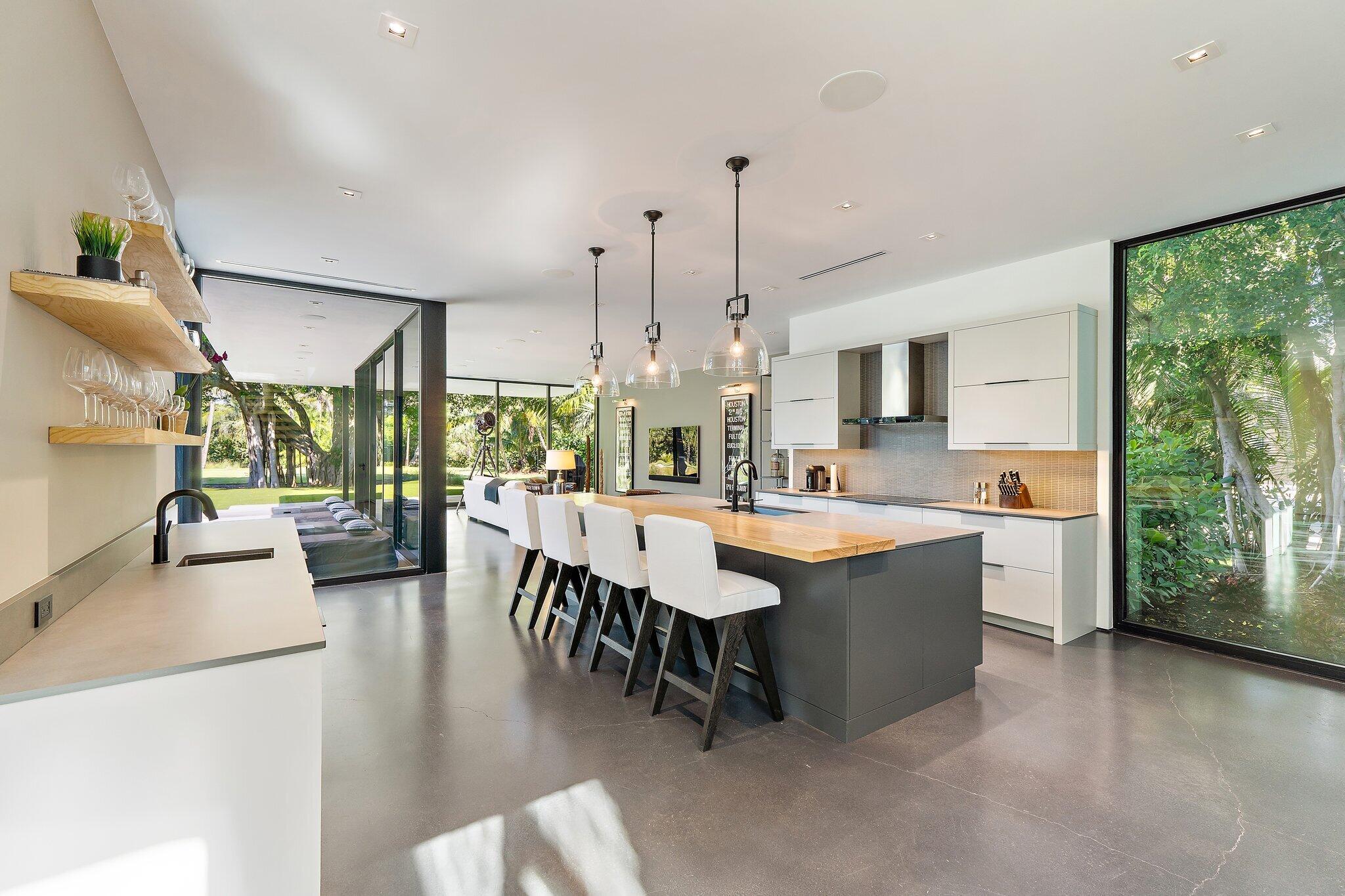 12 North Beach Road Jupiter Island, FL 33455 - Photo 57 of 95 a large kitchen with kitchen island a large window in it
