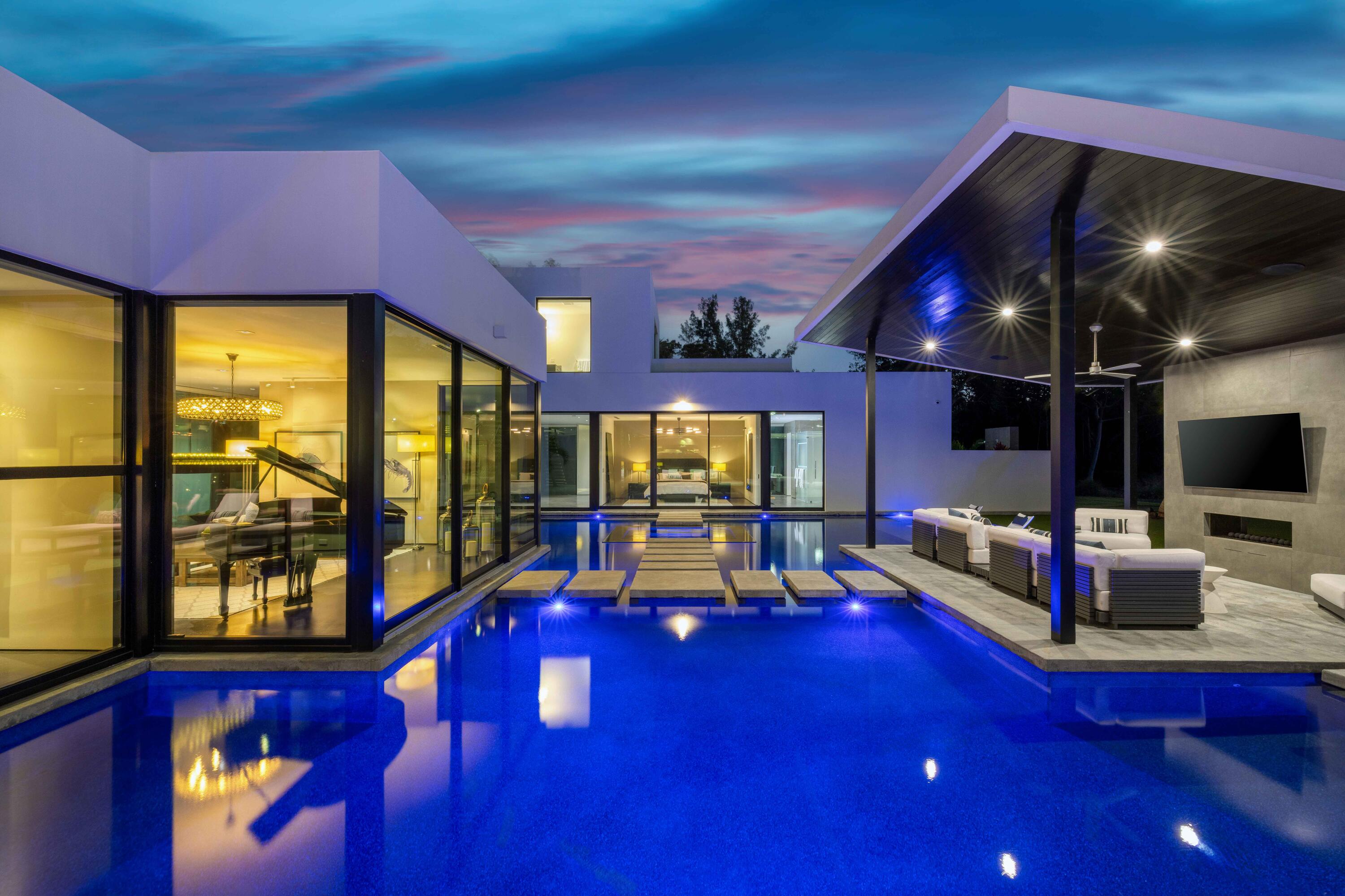 12 North Beach Road Jupiter Island, FL 33455 - Photo 62 of 95 a living room with furniture gaming tables and a flat screen tv