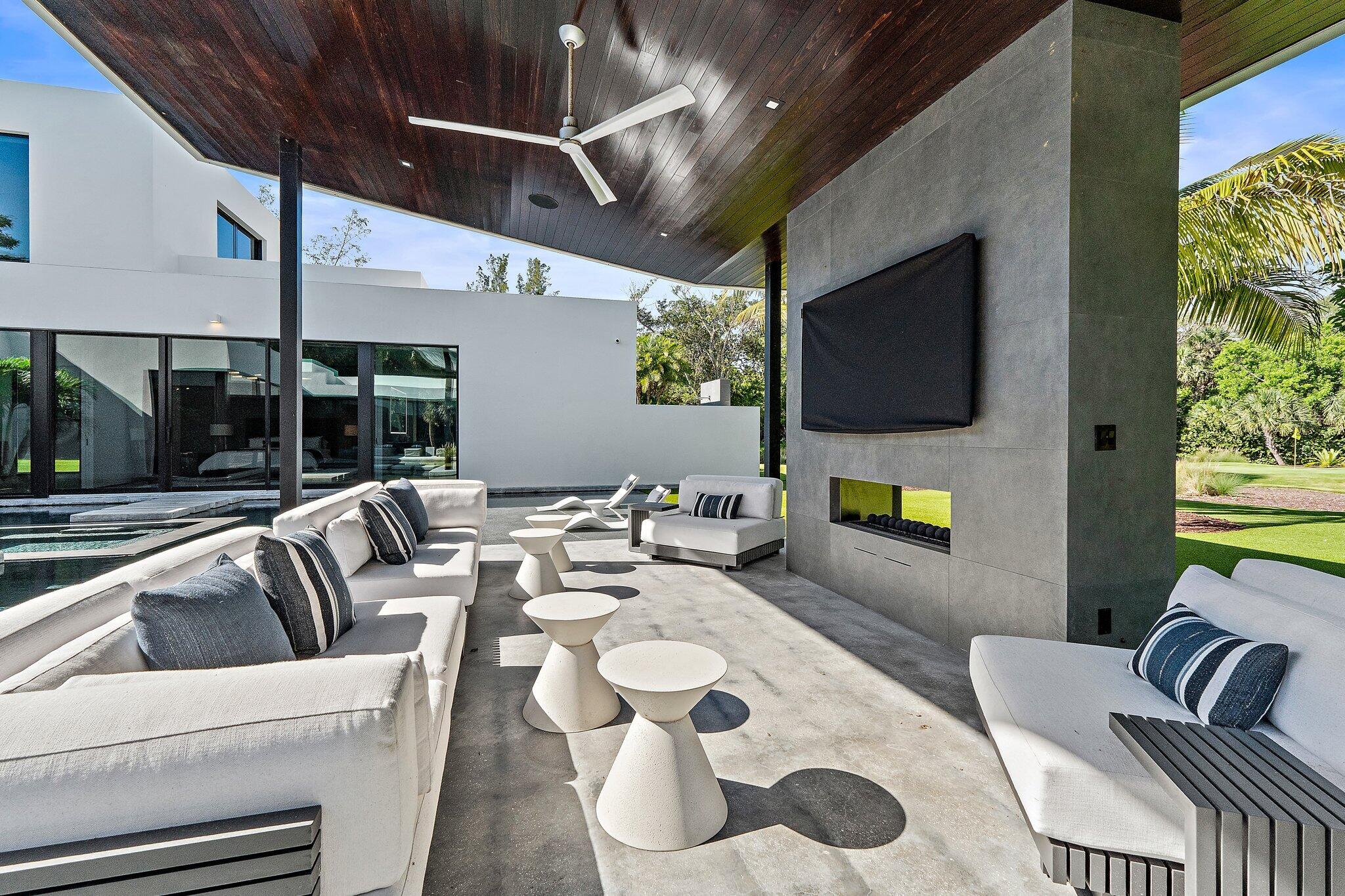 12 North Beach Road Jupiter Island, FL 33455 - Photo 63 of 95 a living room with furniture and a flat screen tv