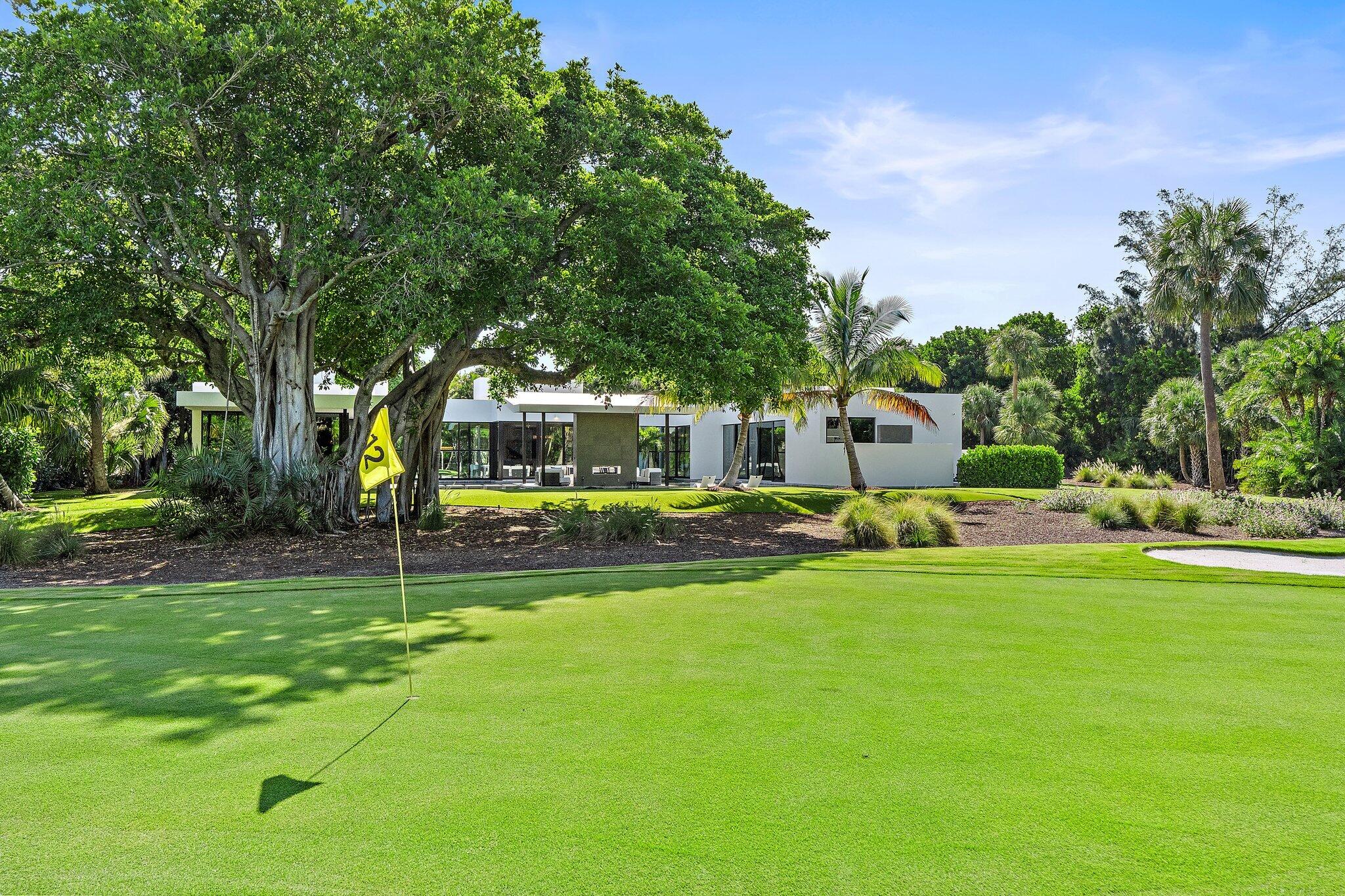 12 North Beach Road Jupiter Island, FL 33455 - Photo 74 of 95 a view of a house with a big yard and large trees