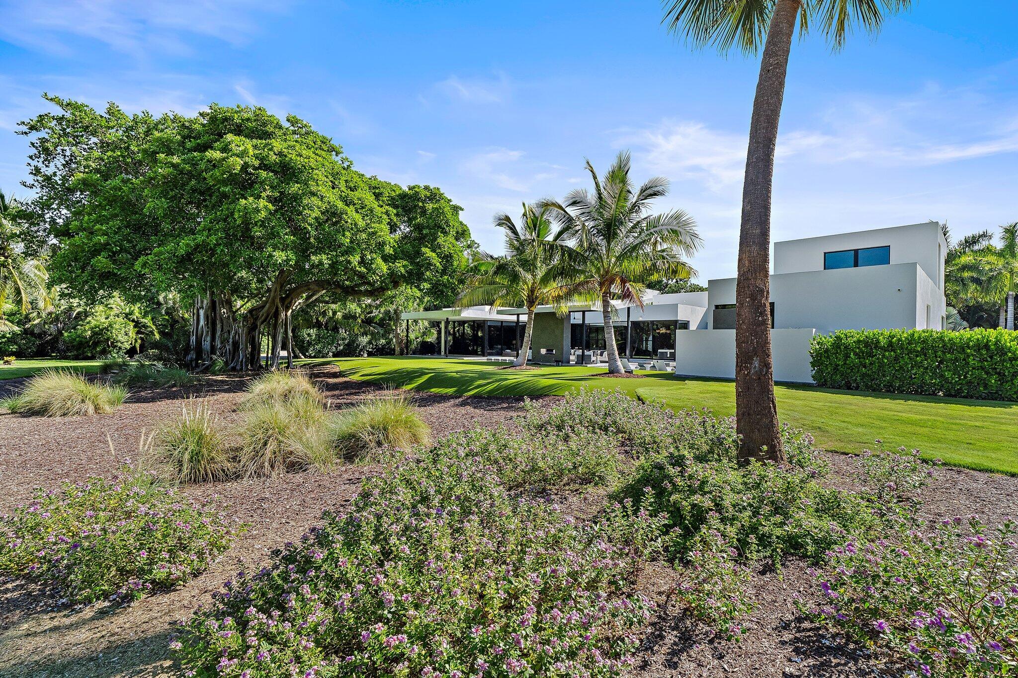 12 North Beach Road Jupiter Island, FL 33455 - Photo 75 of 95 a view of a garden with a tree