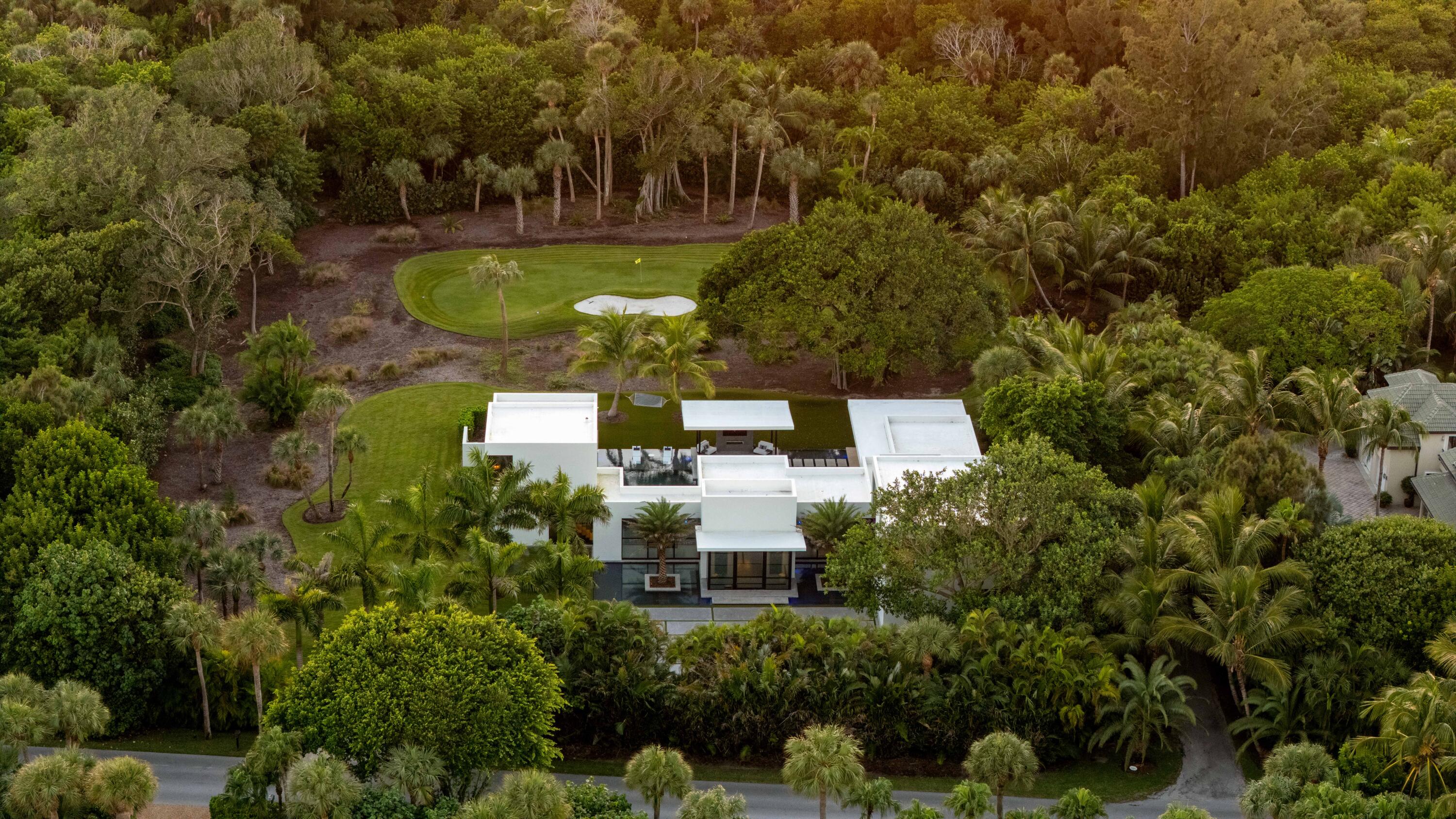 12 North Beach Road Jupiter Island, FL 33455 - Photo 81 of 95 an aerial view of a house with a garden