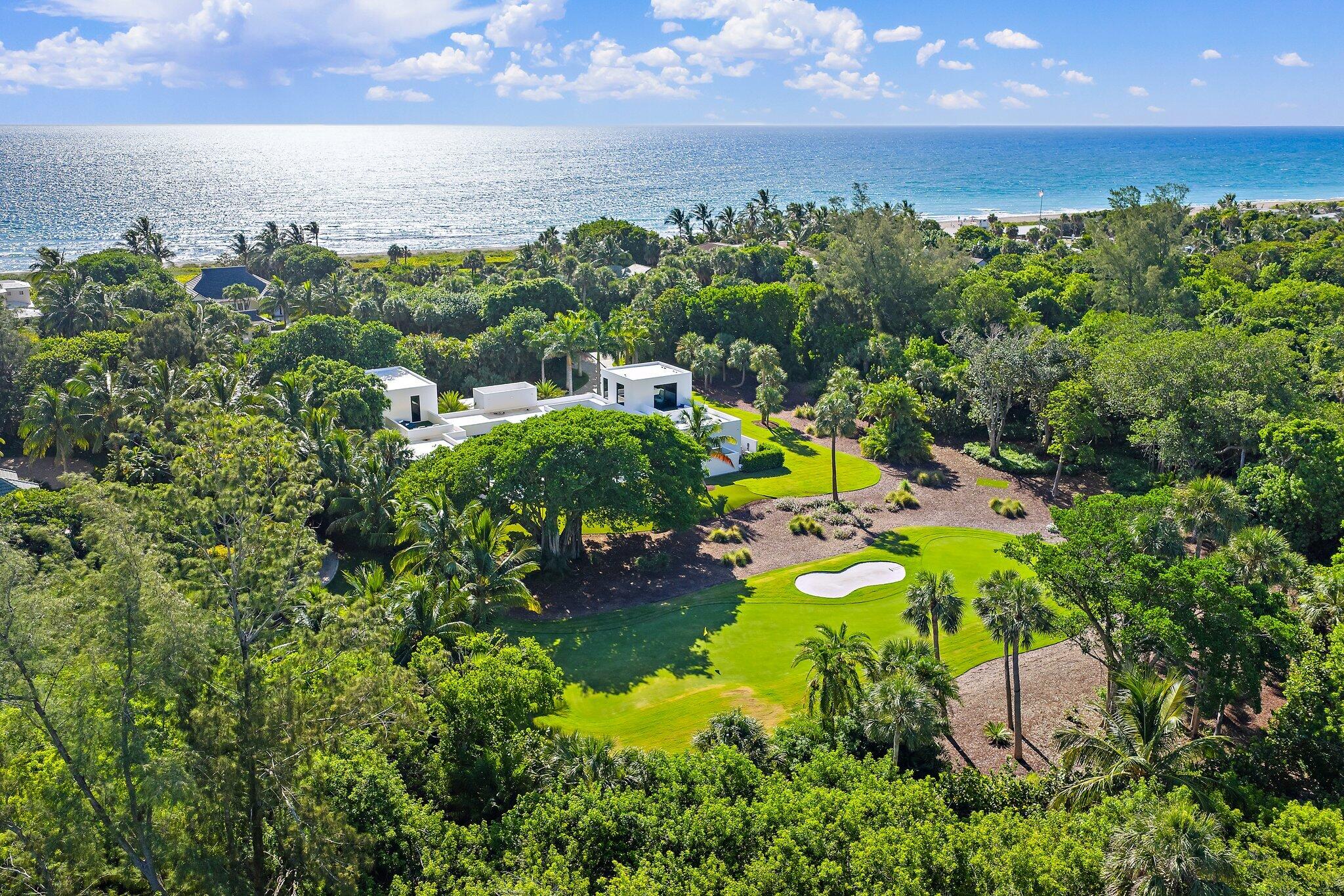 12 North Beach Road Jupiter Island, FL 33455 - Photo 91 of 95 an aerial view of a houses with a yard