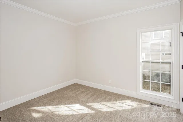 a view of empty room with windows
