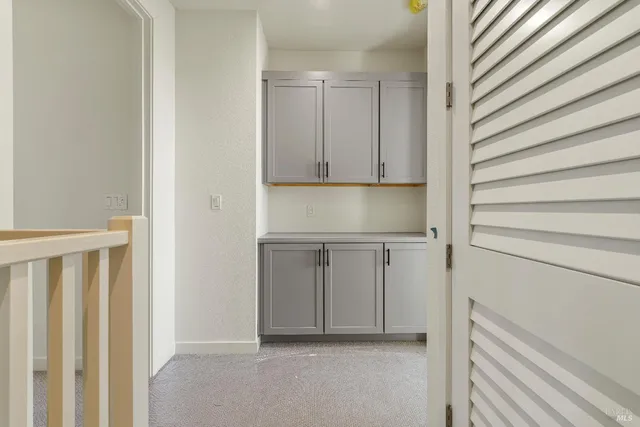 a view of a kitchen from the hallway