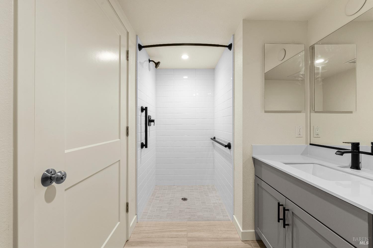 209 Wellness Way Rohnert Park, CA 94928 - Photo 27 of 30 a bathroom with a shower sink and mirror