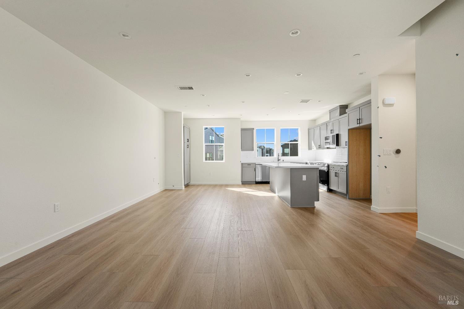 209 Wellness Way Rohnert Park, CA 94928 - Photo 4 of 30 a open kitchen with stainless steel appliances granite countertop a dishwasher and a refrigerator with wooden floor