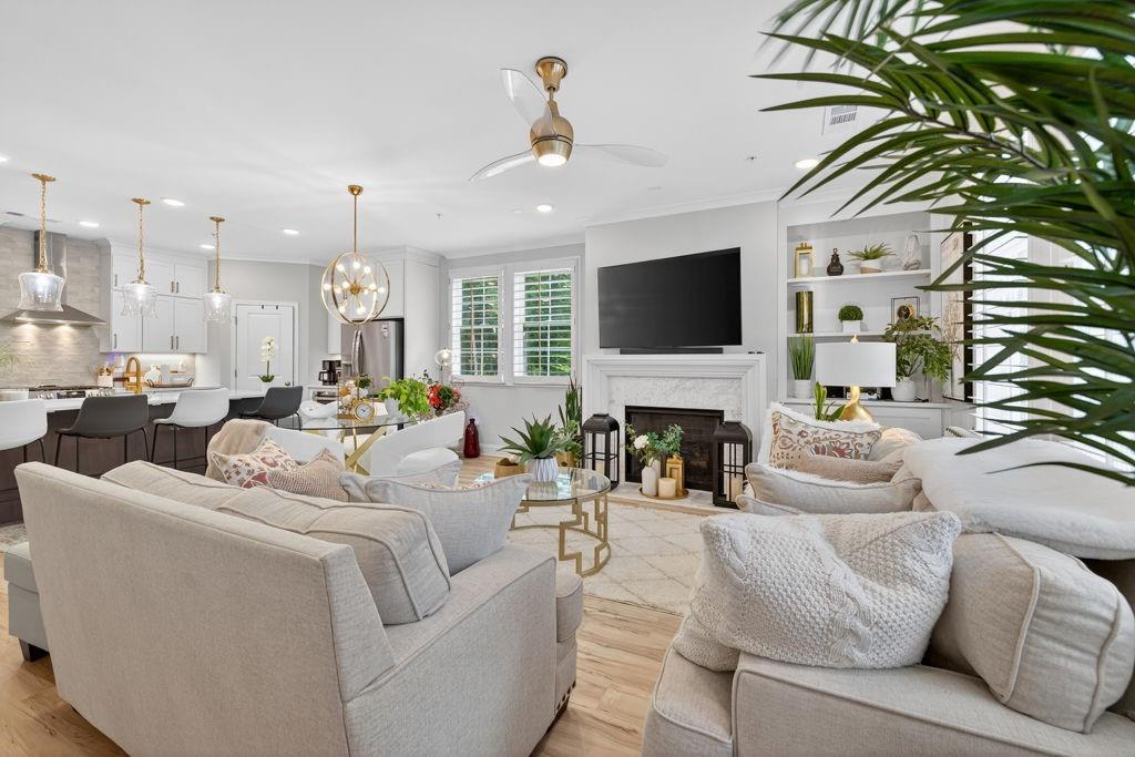 425 Retreat Lane Canton, GA 30114 - Photo 16 of 55 a living room with furniture a fireplace and a flat screen tv