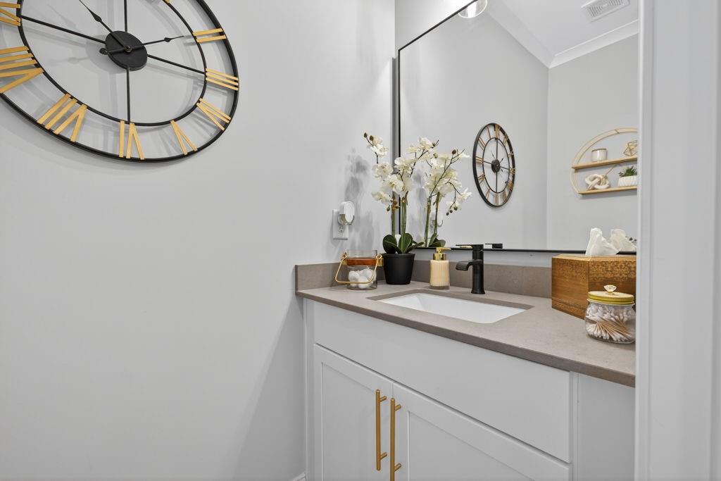 425 Retreat Lane Canton, GA 30114 - Photo 17 of 55 a bathroom with a sink and a mirror