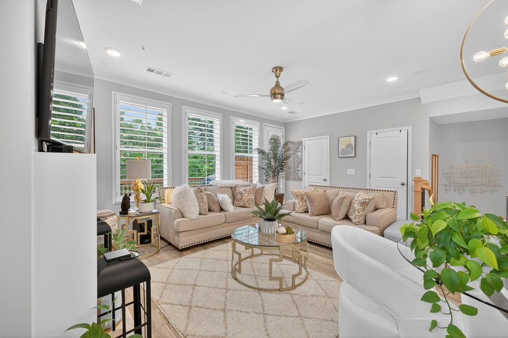 425 Retreat Lane Canton, GA 30114 - Photo 18 of 55 a living room with furniture and a large window