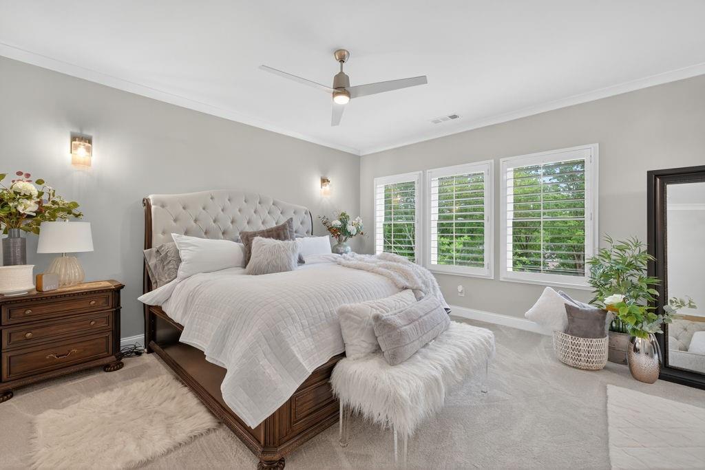 425 Retreat Lane Canton, GA 30114 - Photo 22 of 55 a bedroom with a large bed and windows