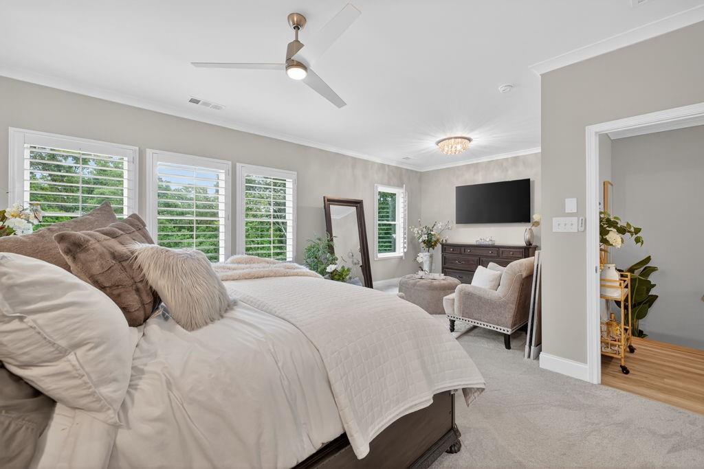 425 Retreat Lane Canton, GA 30114 - Photo 23 of 55 a bedroom with a bed and a flat screen tv