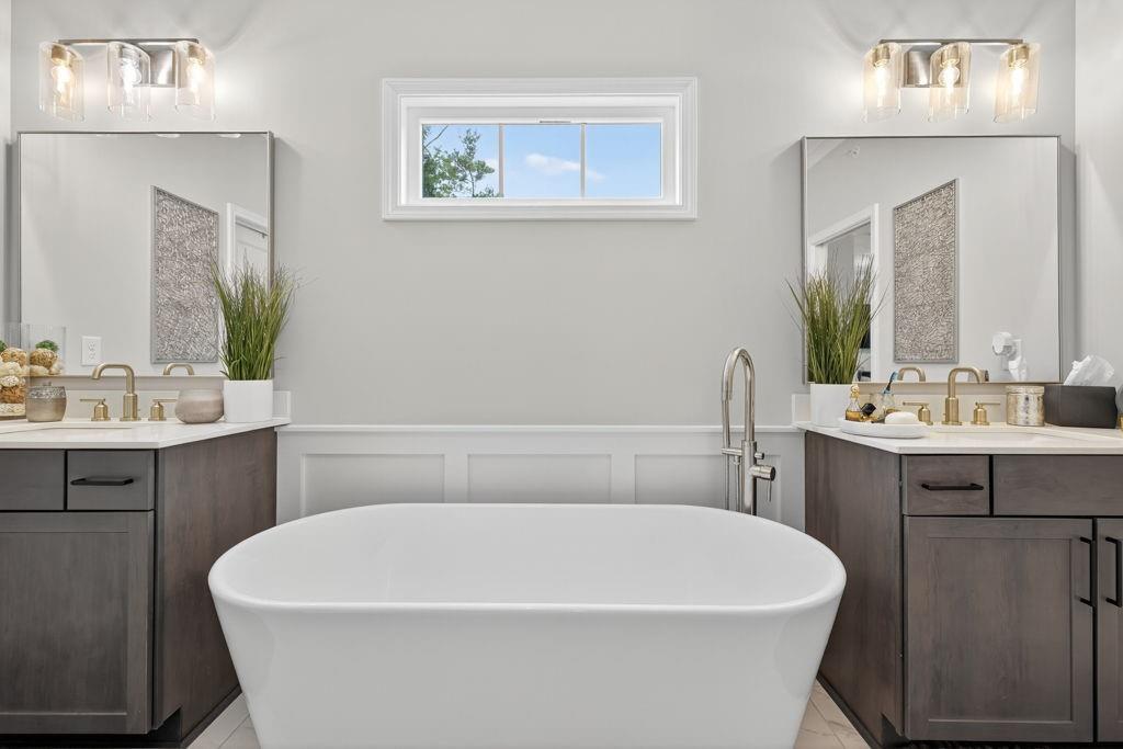 425 Retreat Lane Canton, GA 30114 - Photo 29 of 55 a white bath tub sitting next to a white sink